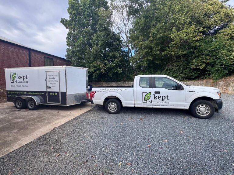 Kept Landscaping branded pickup truck and enclosed trailer