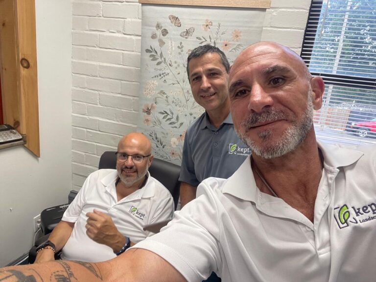 Three Kept Landscaping team members in their office